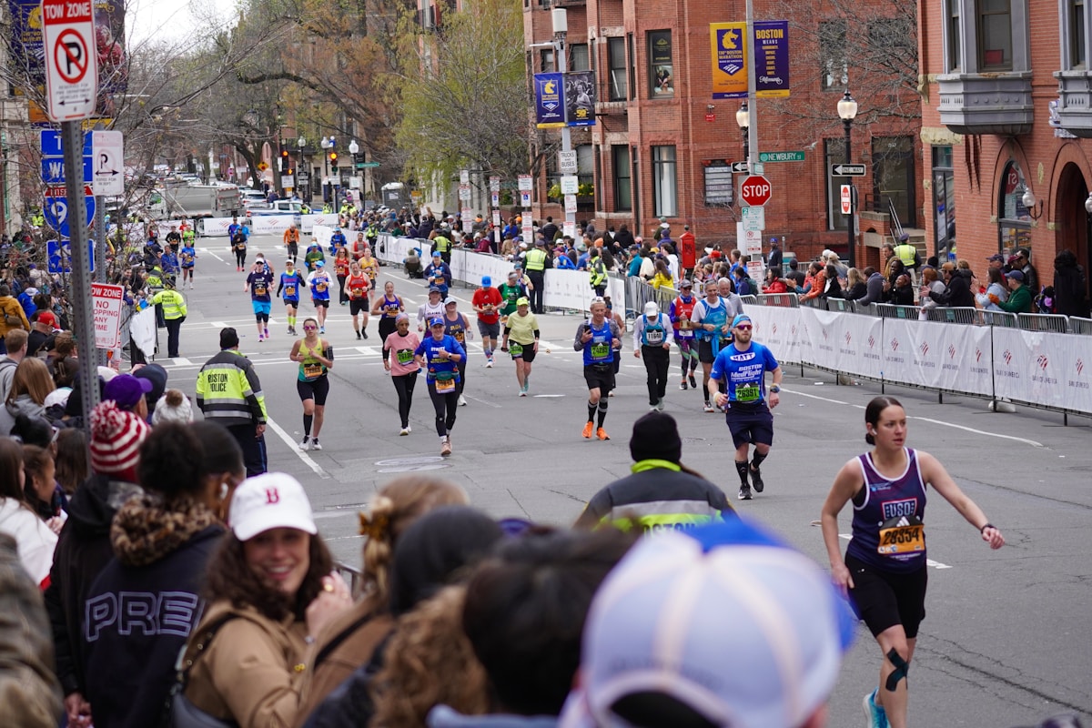 Fellow Runners Rally Around Struggling Competitor at Boston Marathon